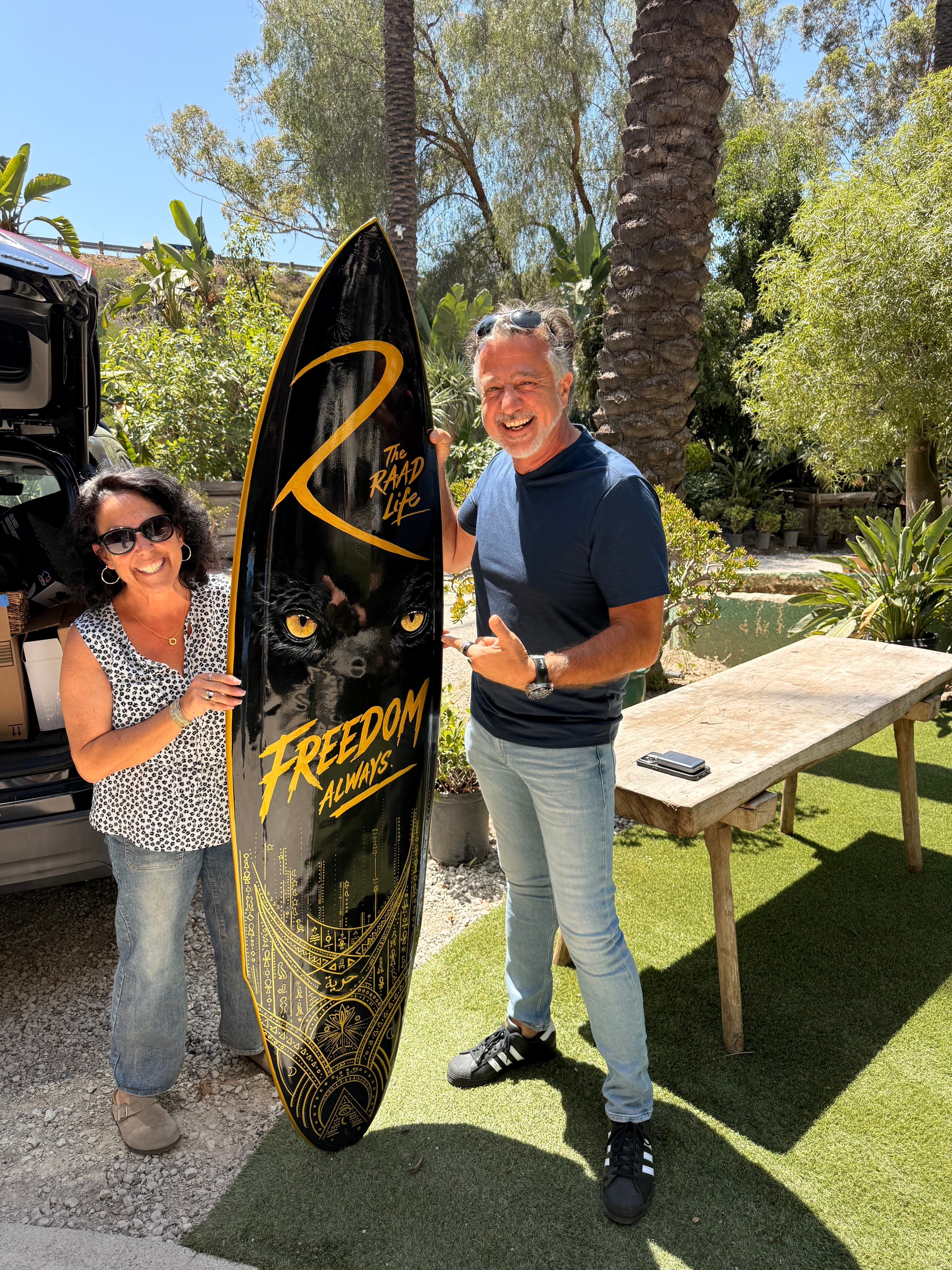 Hand-painted zebra jungle surfboard by Shannon Paints
