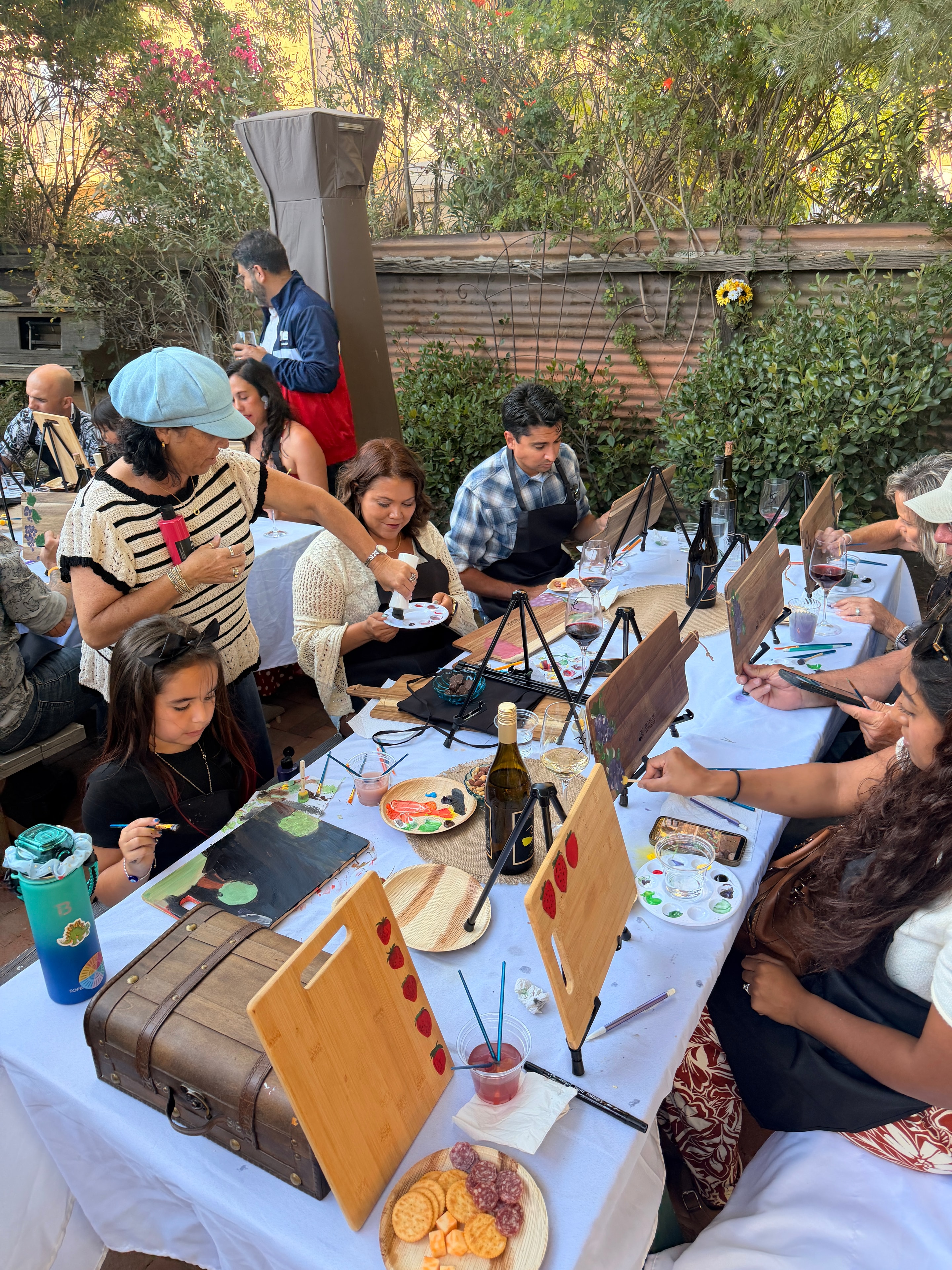 Guests with hand-painted boards at Shannon Paints live event